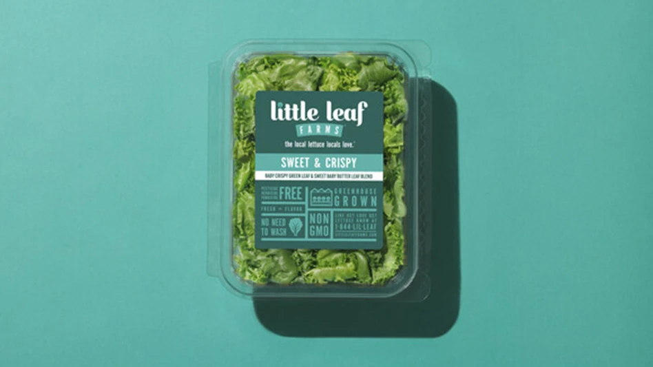 A clamshell plastic package of green lettuce with a teal label that reads Little Leaf Farms Sweet & Crispy. The package is on a teal background.