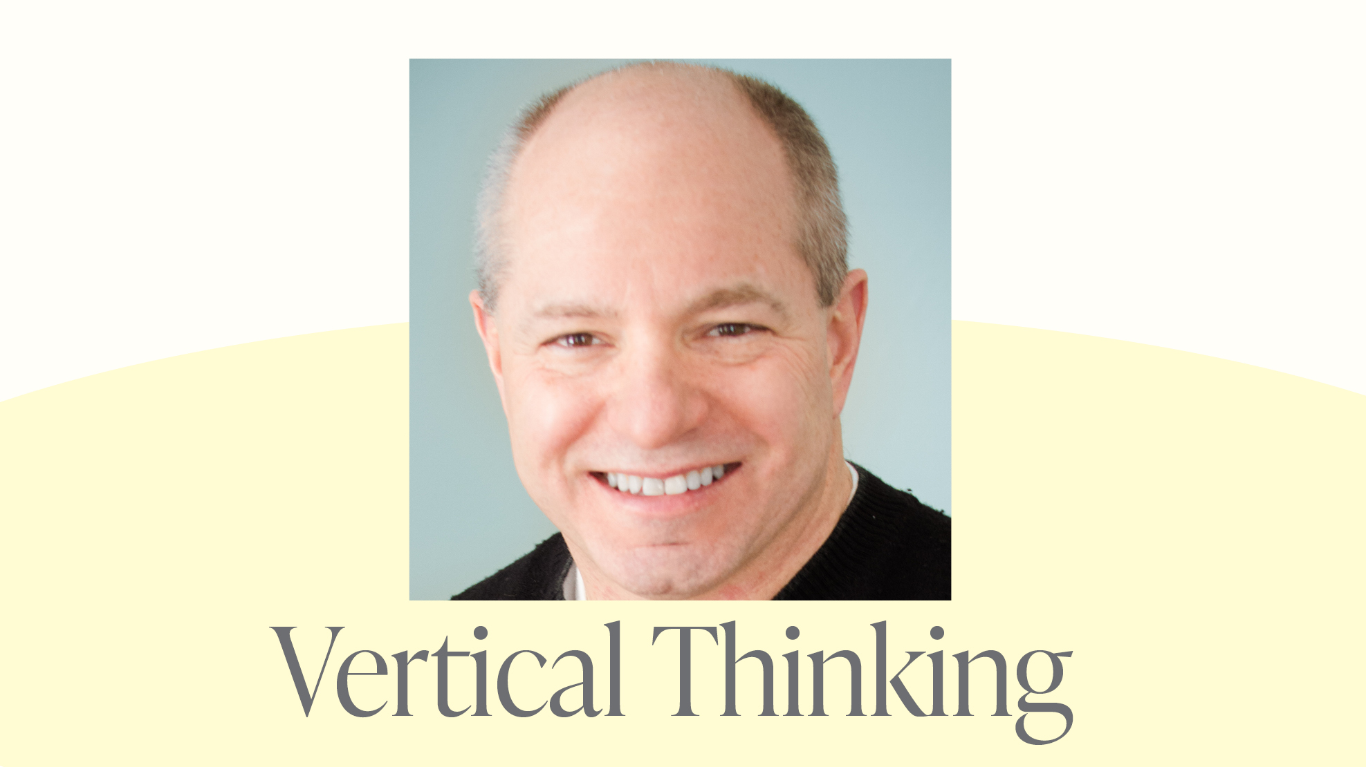A man wearing a black shirt with a blue-gray background behind him. Below him are the words Vertical Thinking.