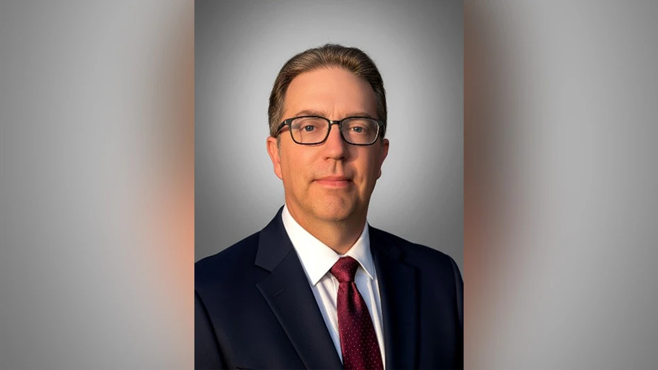 Plastic packages of salad meal kits on a table.