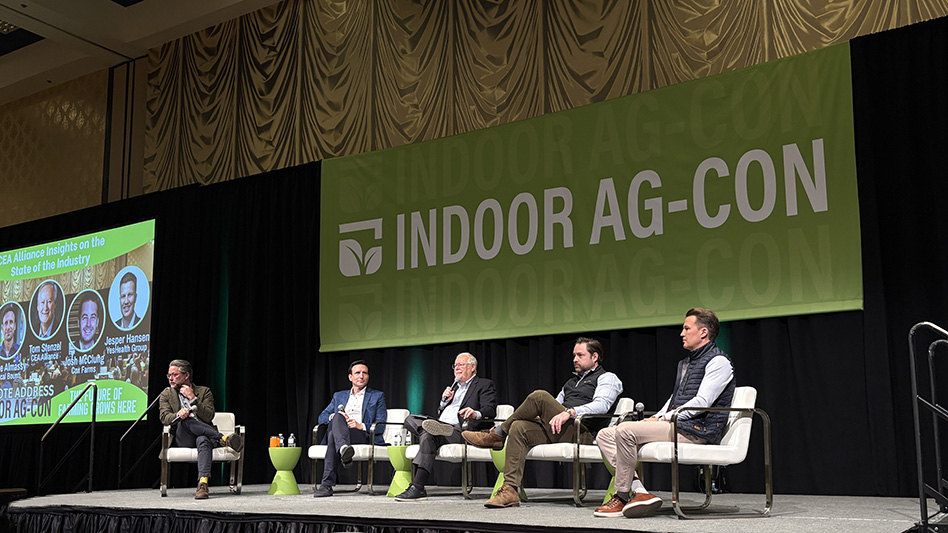 Members of the Indoor Ag-Con Keynote panel discussing a topic on stage.