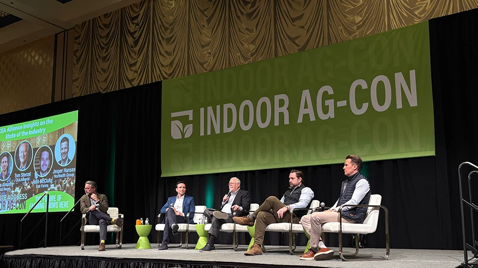 Members of the Indoor Ag-Con Keynote panel discussing a topic on stage.
